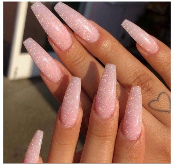 Elegant Sparkling Pink Ombre Stiletto Nails with Glamorous Finish.