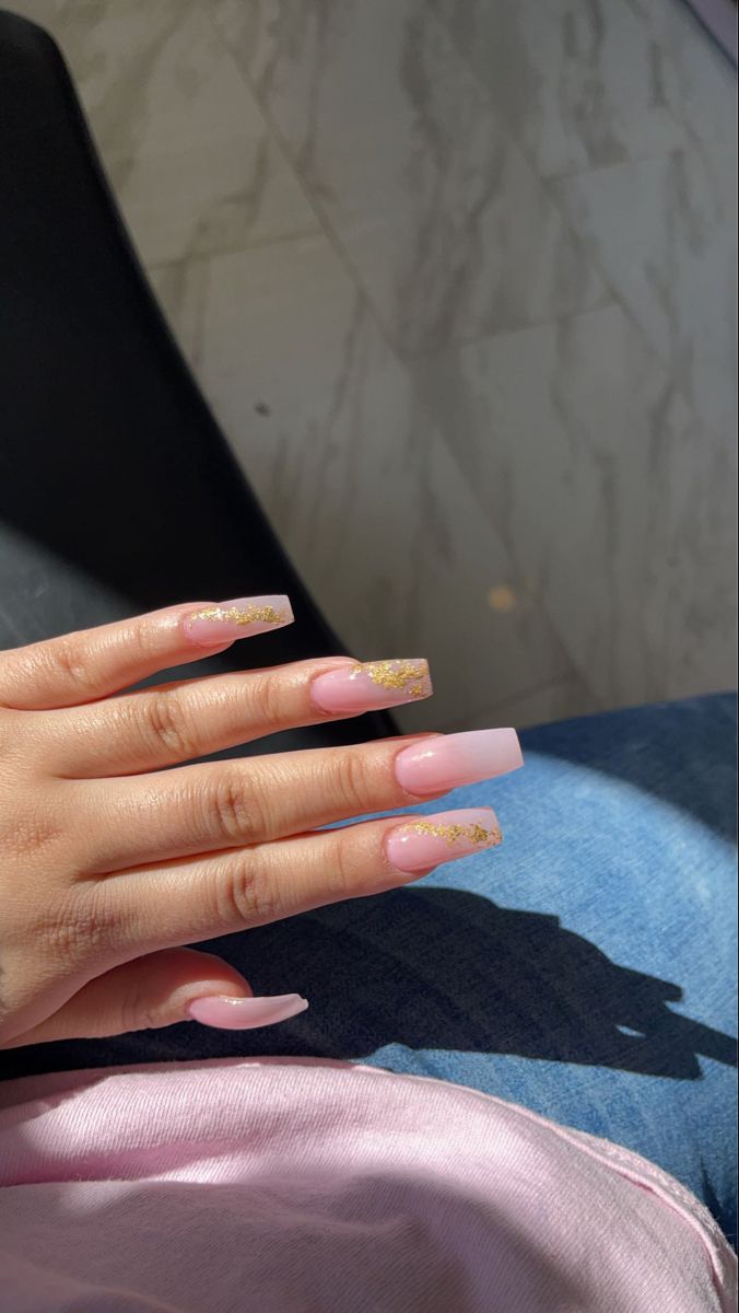 Elegant Long Square Nail Design with Soft Pink Base and Gold Glitter Accents