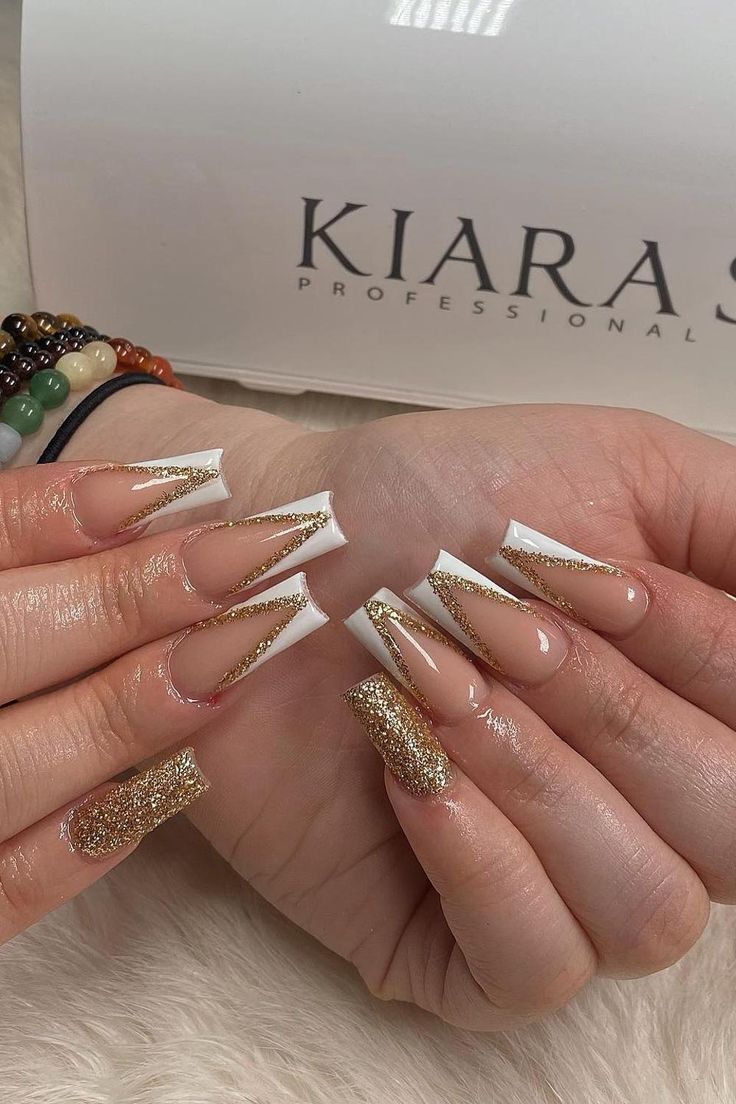 Elegant Nail Design: Classic White Tips with Intricate Gold Shimmer Accents