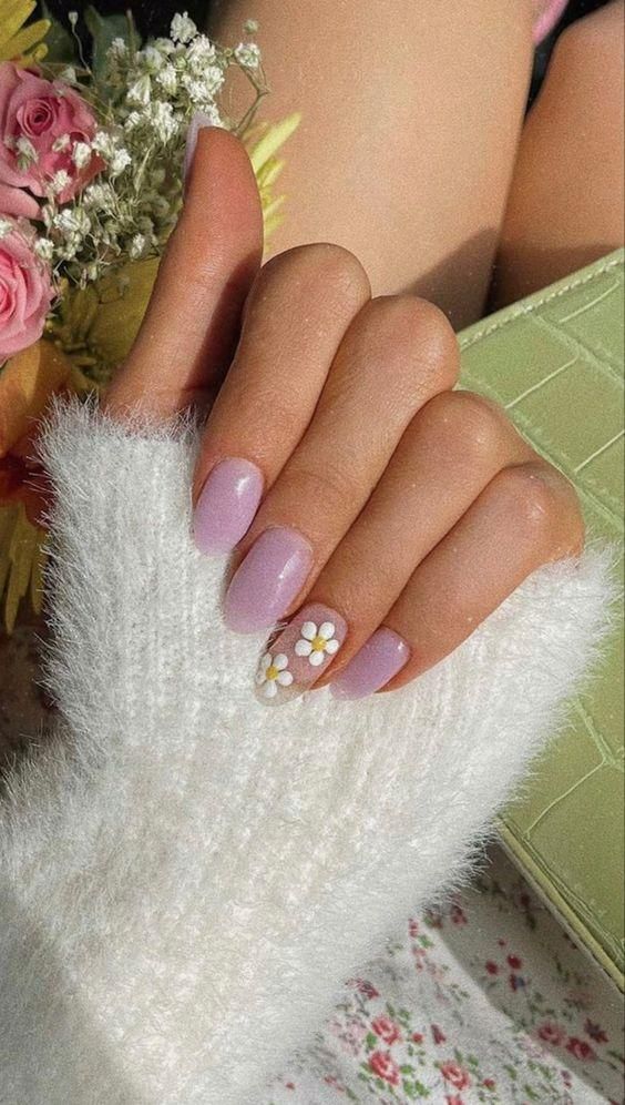 Elegant Pastel Lavender Nails with Floral Accents and Cozy Sweater Contrast.