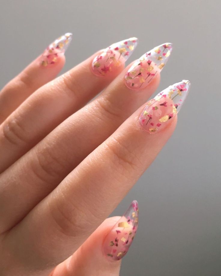 Elegant Floral Nail Design with Transparent Tips and Soft Pink Hues.