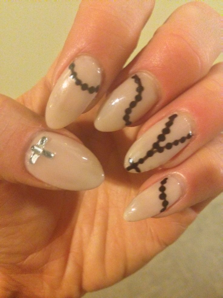 Chic Nail Design: Neutral Base with Intricate Black Lines and Silver Accent