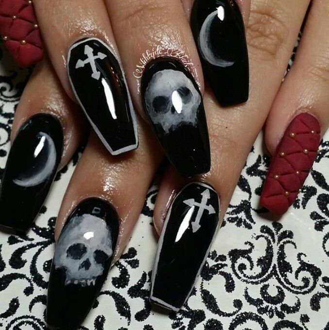 Gothic Nail Art: Black Base with Skull Motifs and Textured Red Accents