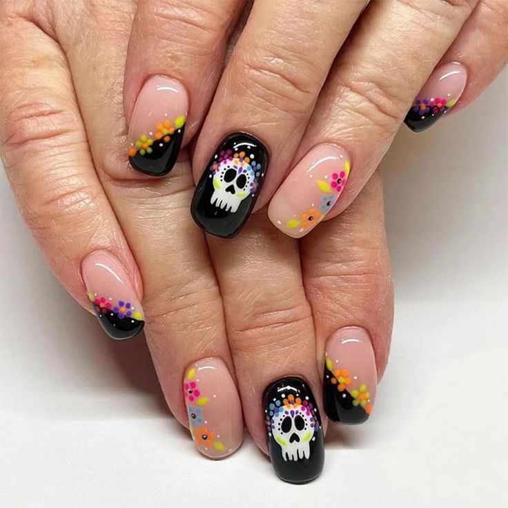 Playful and Edgy Colorful Skull Nail Art with Floral Accents