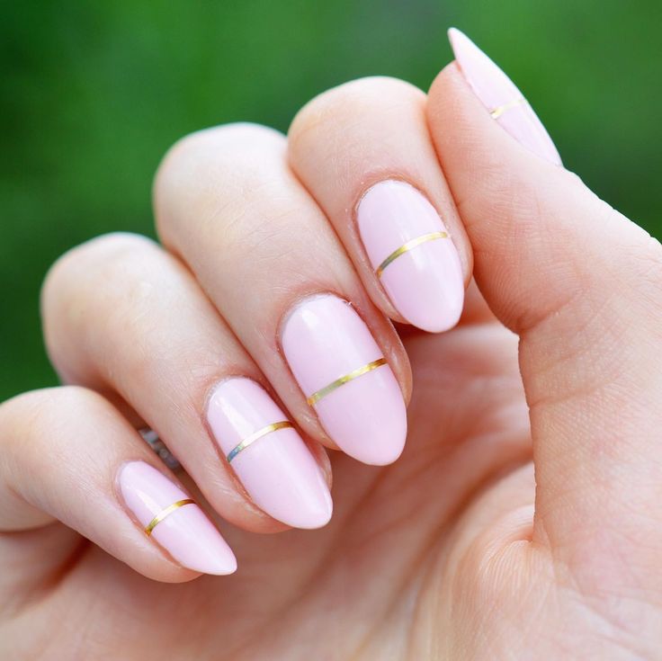 Sophisticated Elegance: Chic Pink Nails with Glossy Finish and Gold Accents