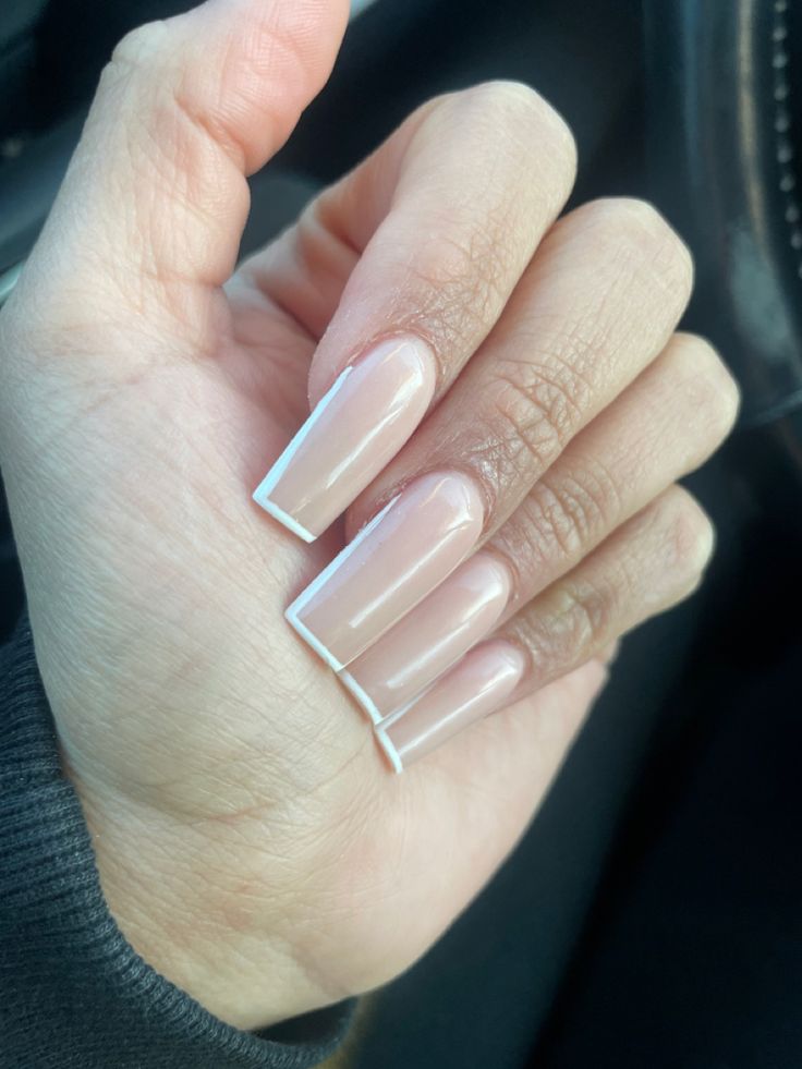 Sophisticated Long Square Nails with Soft Nude Base and Crisp White Tips