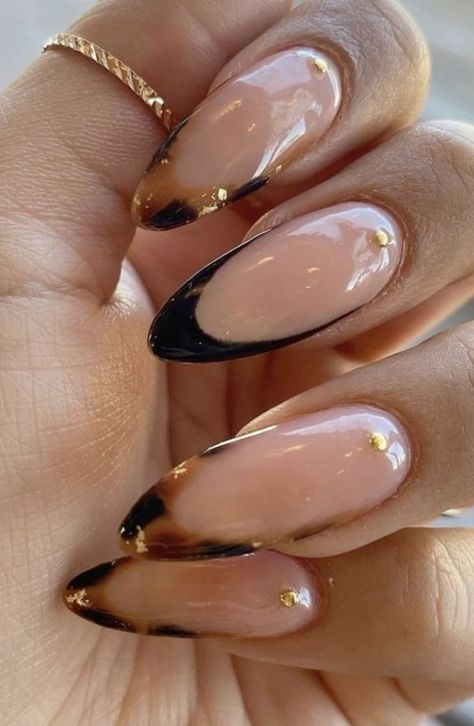 Elegant Almond-Shaped Gradient Nails with Gold Accents: A Perfect Blend of Boldness and Subtlety.