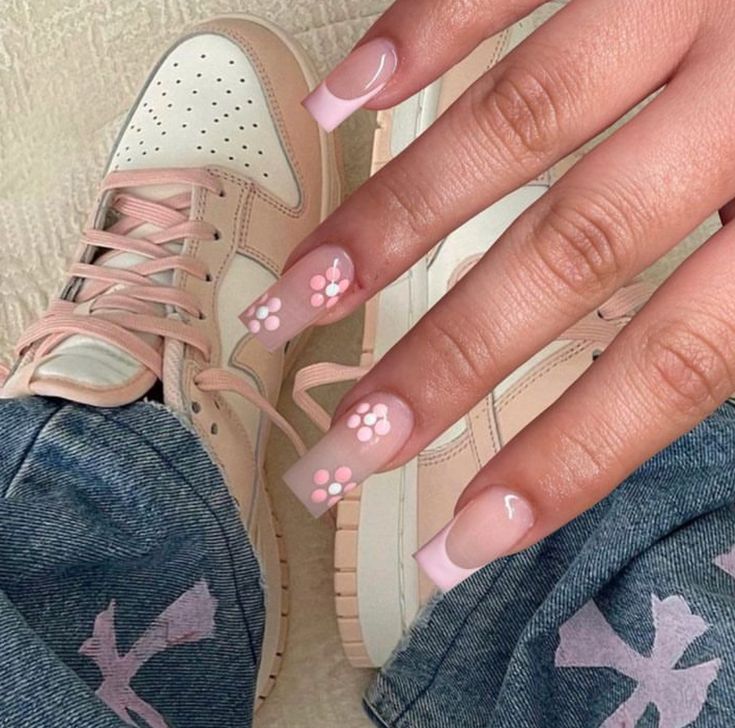 Elegant Floral Pink Nail Design with Glossy Finish and Trendy Footwear.