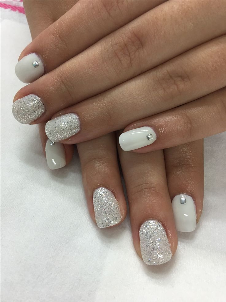 Elegant White and Silver Glitter Nail Design with Rhinestone Accents