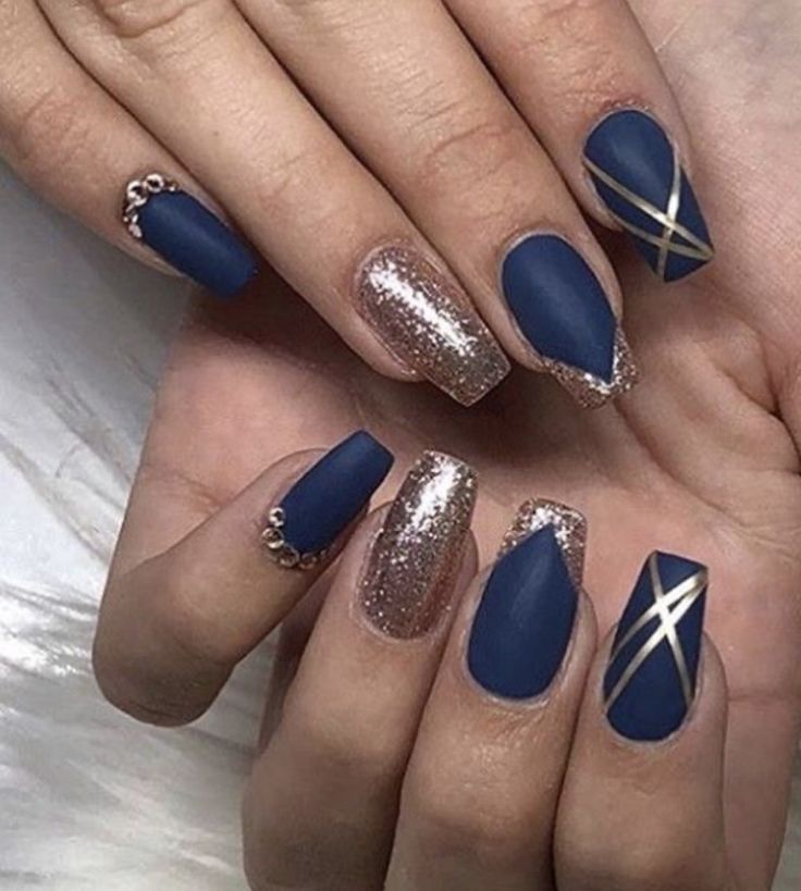 Sophisticated Nail Design: Matte Navy Blue Meets Shimmering Rose Gold with Gold Accents.