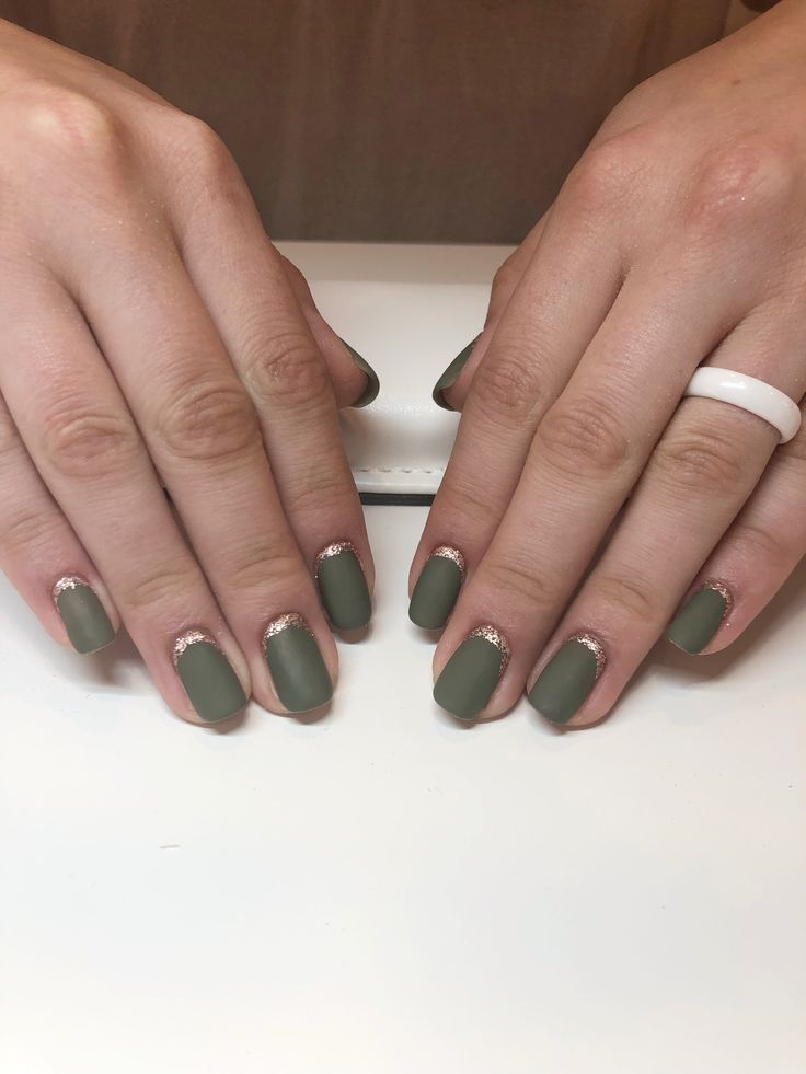 Sophisticated Matte Olive Green Nail Design with Chic Sparkling Accents.