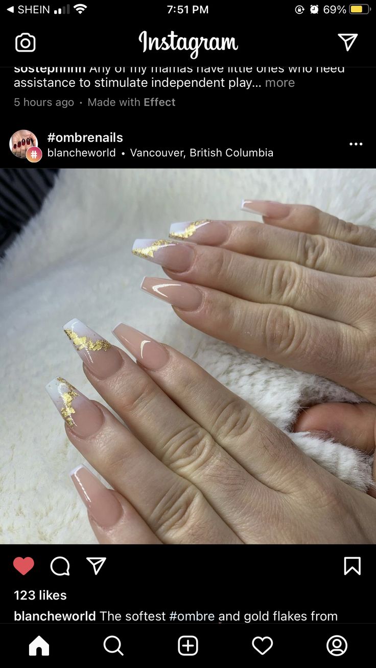 Chic Ombre Nail Design: Nude to White Tips with Elegant Gold Flakes.