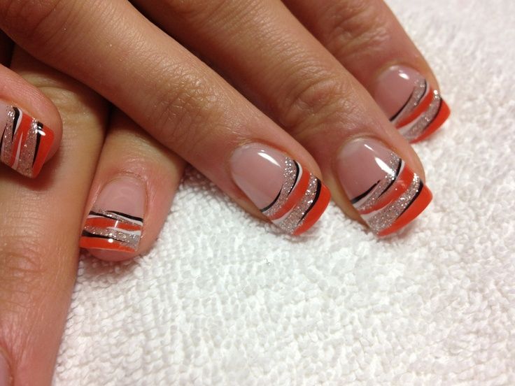 Stylish Orange and Nude Nail Design with Sleek Black Lines and Sparkling Silver Accents.