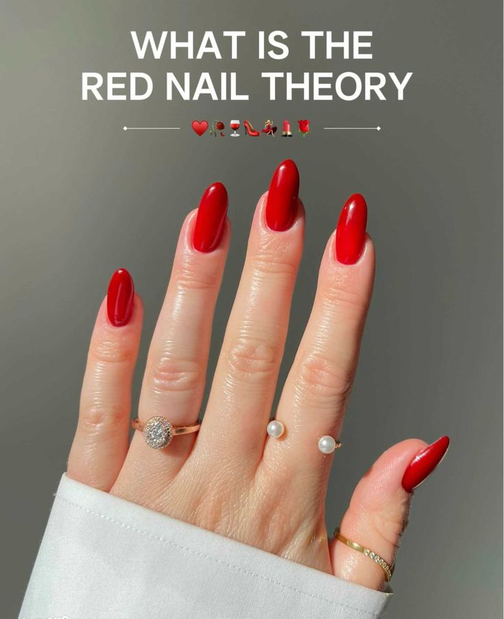 Sophisticated Elegant Red Manicure with Almond-Shaped Nails and Delicate Rings.