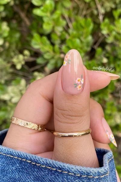 Charming Floral Nail Design with Delicate Blossoms on Nude Background