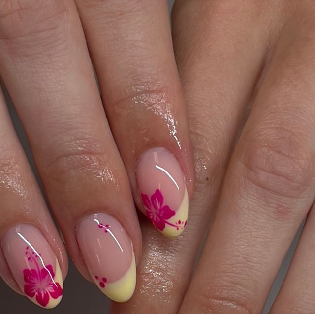 Cheerful Floral Nail Design with Soft Pink Base and Vibrant Yellow Tips