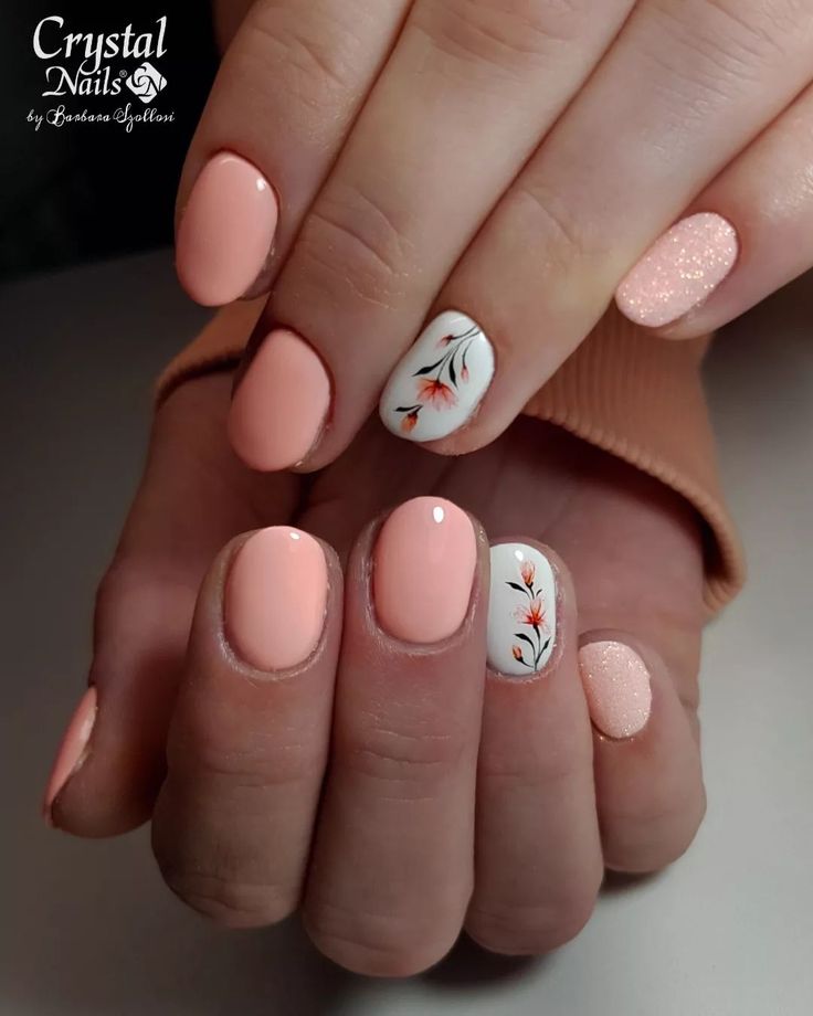 Elegant Pastel Peach Nails with Floral Accents and Glitter for Any Occasion