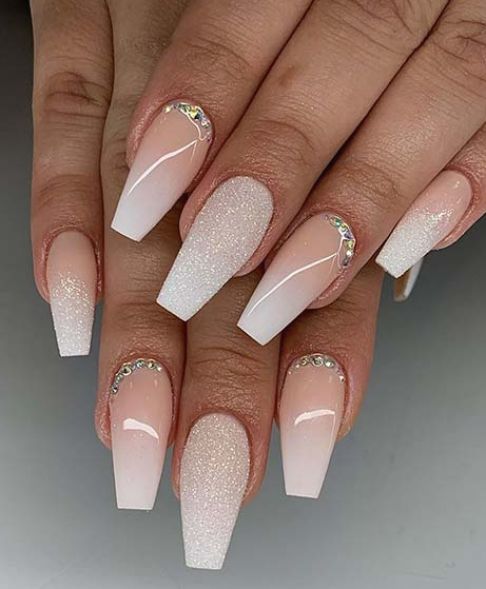 Glamorous Almond-Shaped Nails with Gradient Sparkle and Rhinestone Accents.