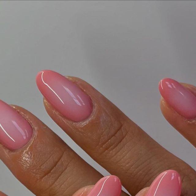 Elegant Ombre Almond Nails: A Chic Gradient from Clear to Delicate Pink.