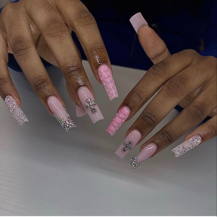 Elegant Intricate Nail Design with Soft Pink Palette and Textured Embellishments.