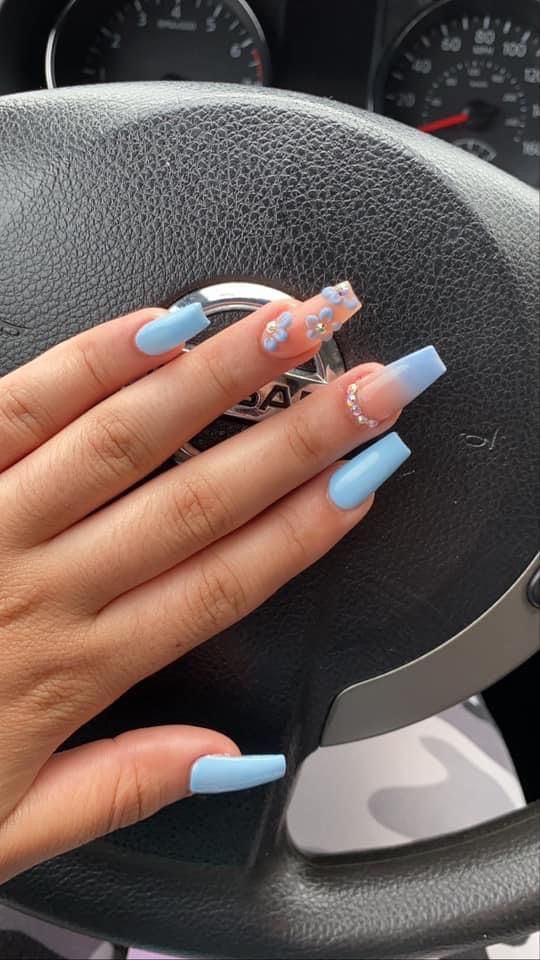 Chic Pastel Blue Nail Design with Shapes, Floral Motif, and Sparkling Rhinestones