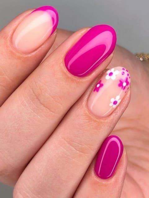 Vibrant Floral Nail Design: Bold Magenta Meets Soft Nude for Spring Elegance.