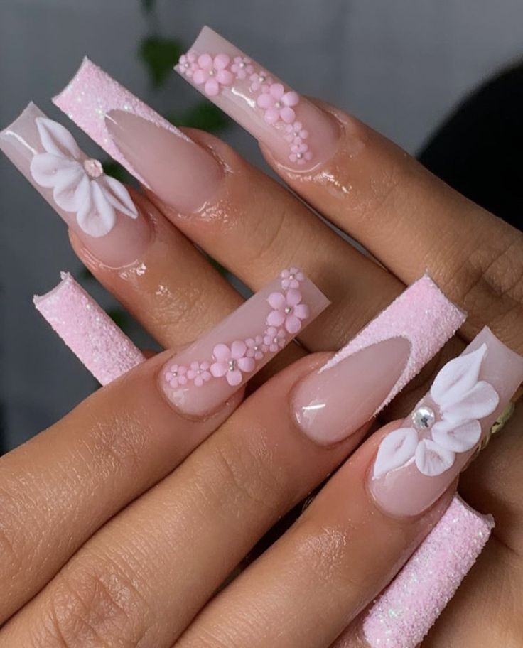 Chic 3D Floral Nail Design in Soft Pink with Glitter Accents.