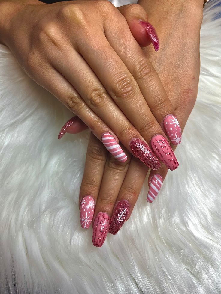 Elegant Pink-Themed Nail Design with Festive Patterns and Glitter Finishes.