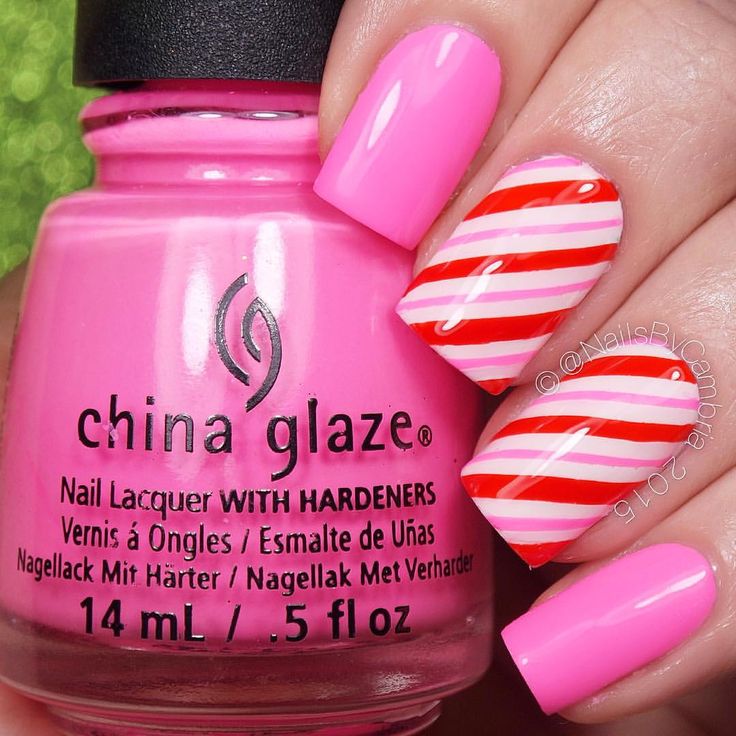 Cheerful Vibrant Pink Nail Design with Glossy Finish and Playful Striped Patterns.