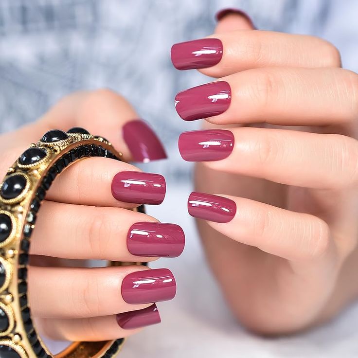 Chic Mauve Nail Design with Glossy Finish and Statement Ring Accent.