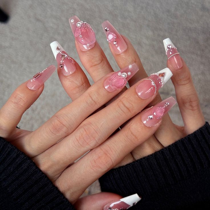 Sophisticated Pink and White Nail Design with Glossy, Matte Finishes and Pearl Accents.