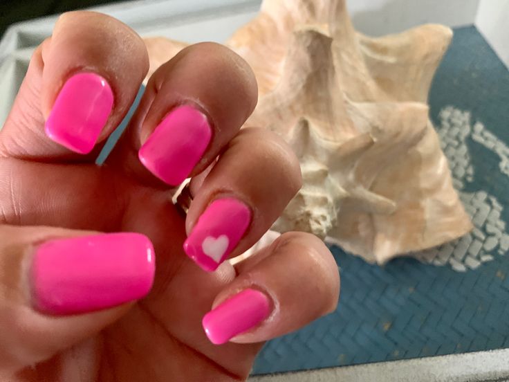 Playful Heart Design on Vibrant Pink Nails for a Cheerful Summer Look.