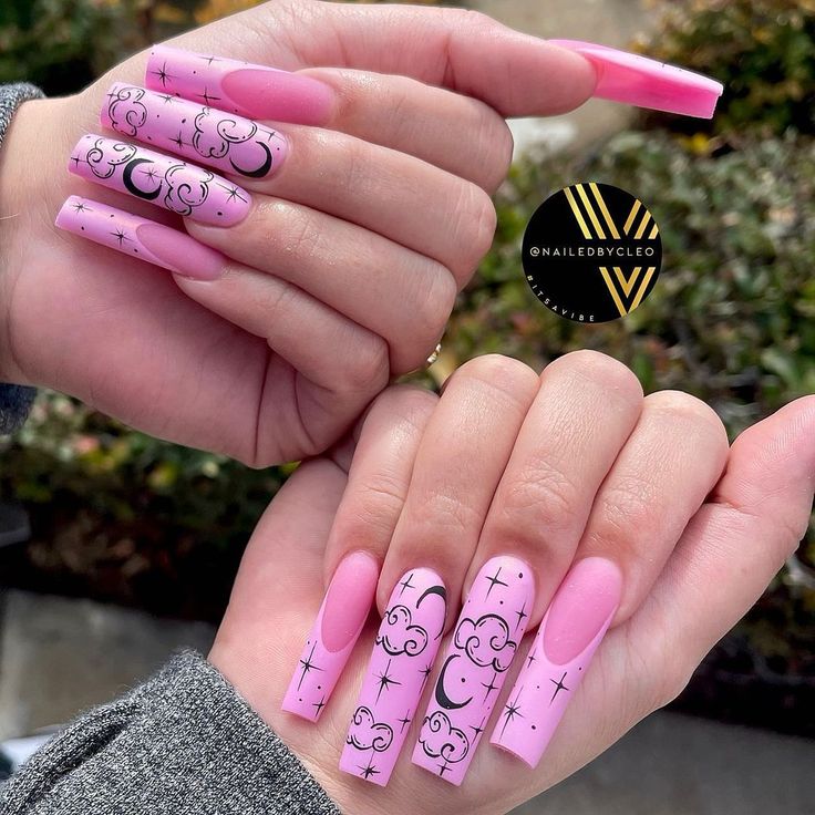 Whimsical Long Pink Tip Nail Design with Black Cloud and Crescent Moon Motifs