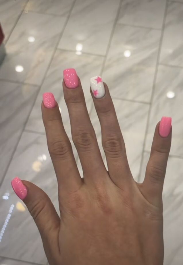 Cheerful Pink Nail Design with Glossy Finish and Playful Star Accent