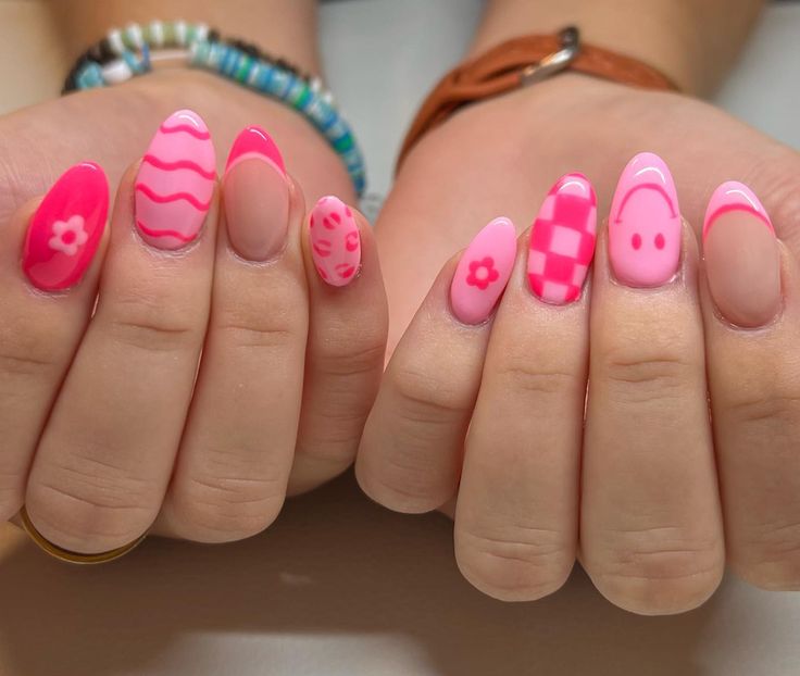 Vibrant Pink Nail Art: Whimsical Floral, Wavy, and Checkered Designs for Cheerful Spring Manicures.