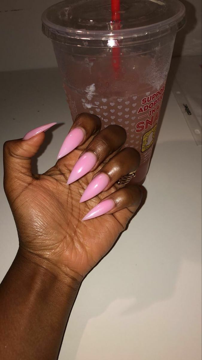 Elegant Long Almond-Shaped Nails in Soft Pink: A Versatile Choice for Any Occasion