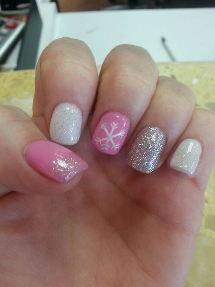 Playful Pink and Silver Nail Design with Glitter and Winter Accents.