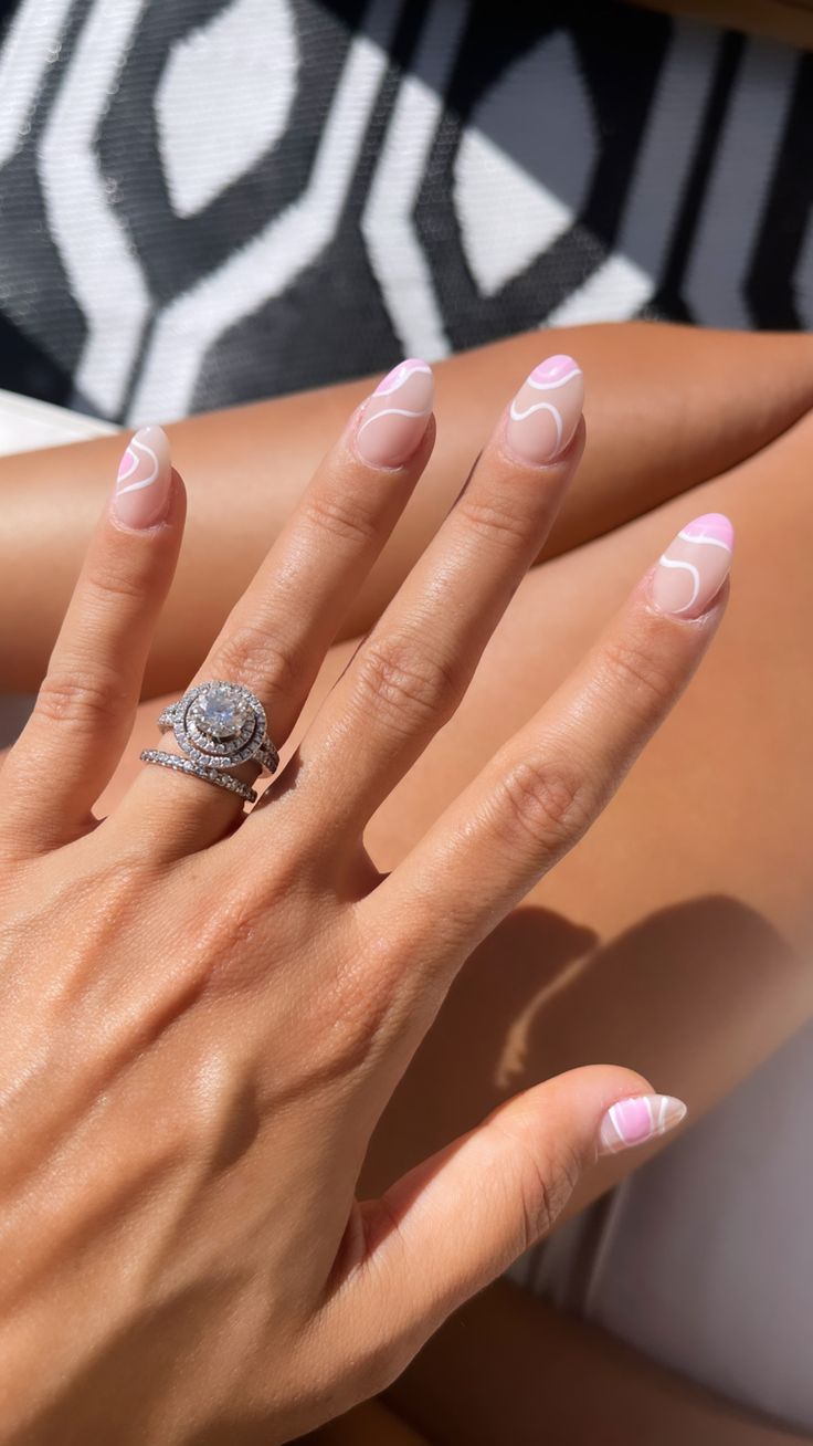 Chic Summer Nail Design: Elegant Pink and Nude Blend with Whimsical White Accents.