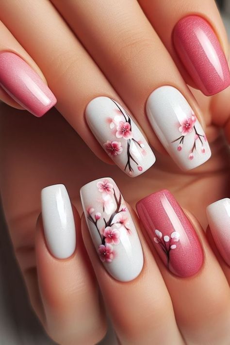 Elegant Floral Nail Design with Soft Pink Blossoms and Contrasting Finishes.