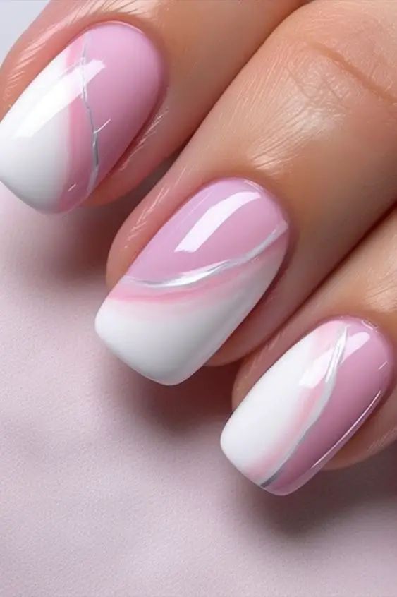 Sophisticated Soft Pink and White Gradient Nail Design with Elegant Swirls.