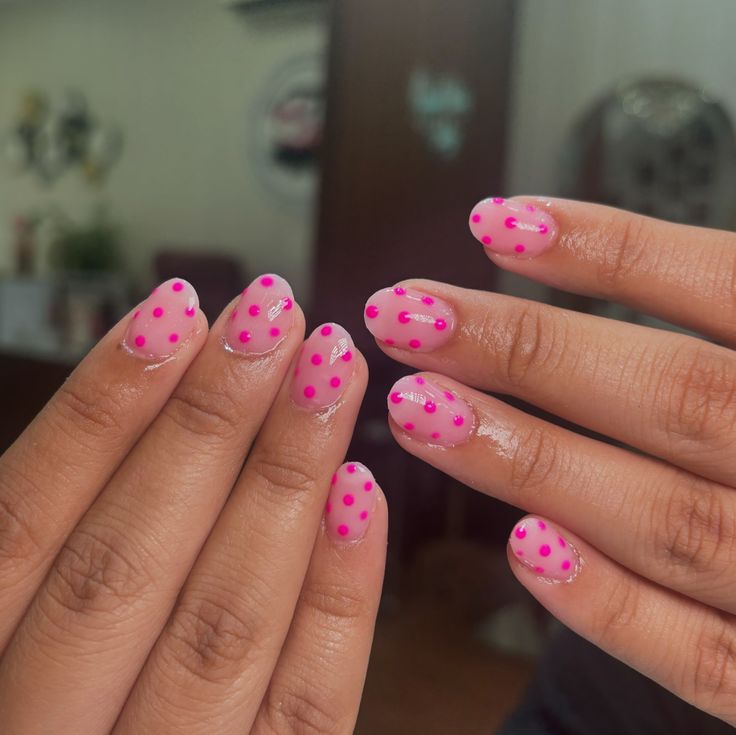 Cheerful Vibrant Pink Polka Dot Nail Design for a Stylish Pop of Color.