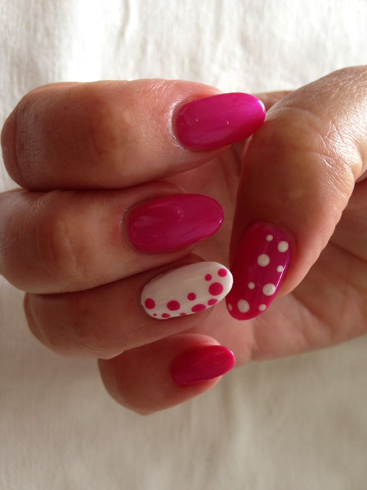 Chic Vibrant Pink Nail Design with Dotted Accent for a Playful Touch.