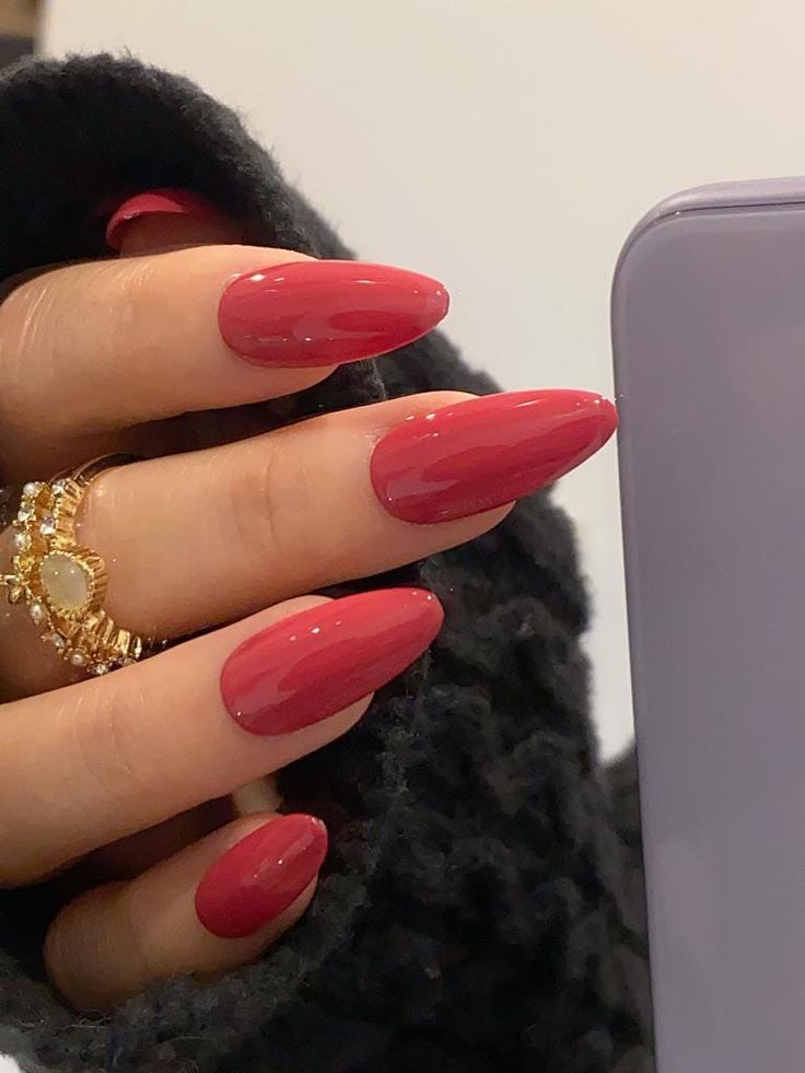 Chic Cherry Red Pointed Nails: A Stylish and Glamorous Manicure.