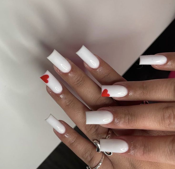 Elegant Matte White Long Square Nails with Playful Red Heart Accents.