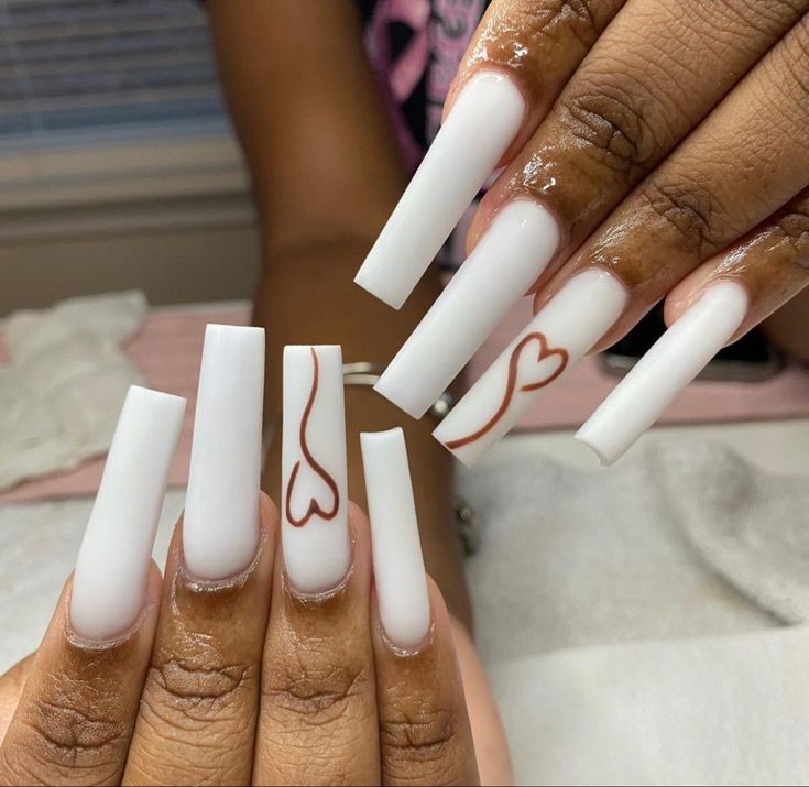 Chic Long White Nails with Romantic Brown Heart Accents