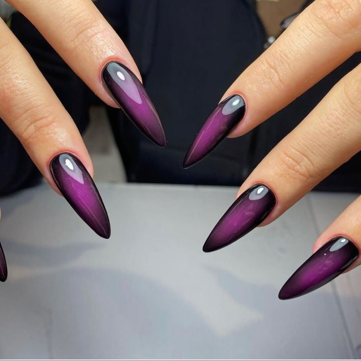 Striking Deep Purple and Black Gradient Ombre Almond-Shaped Nails with Glossy Finish.