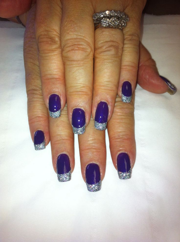 Sophisticated Nail Design: Deep Purple Base with Sparkling Silver Tips for Versatile Glamour.