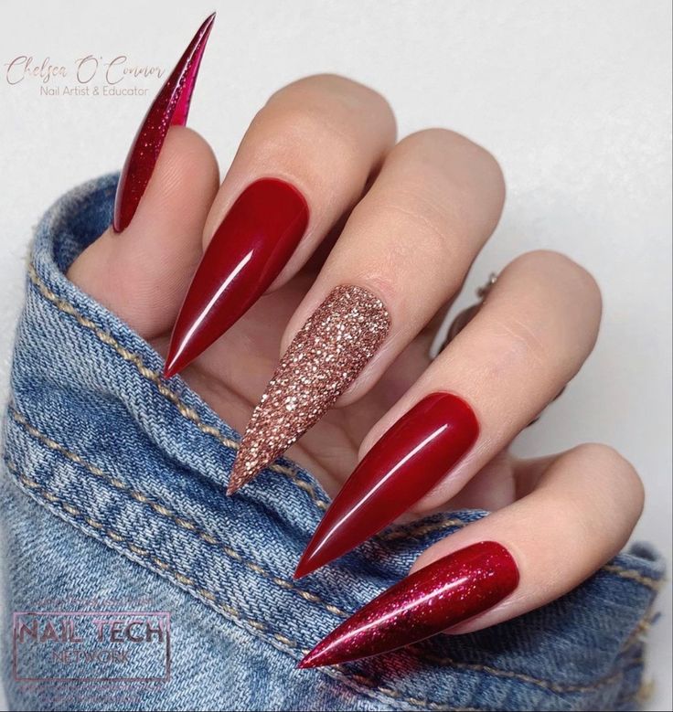 Stylish Stiletto Nails: Bold Red Shades with Glitter Accent for Special Occasions.