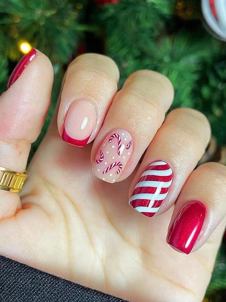 Cheerful Holiday Nail Design with Classic Red, Soft Nude, and Candy Cane Patterns