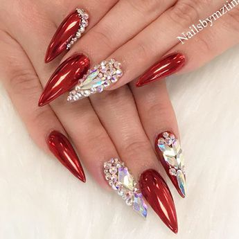 Elegant Glossy Red Stiletto Nails Adorned with Dazzling Gemstones and Rhinestones